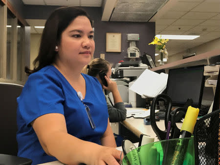 Registered nurse Kara Salonga, pictured at nursing station at the West Virginia University Hospitals in Morgantown, West Virginia, U.S., September 6, 2017. Picture taken September 6, 2017. REUTERS/Mike Wood