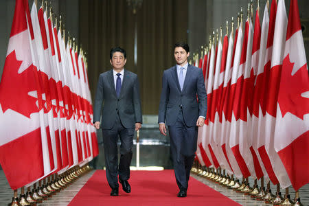 Japan's Prime Minister Shinzo Abe and Canada's Prime Minister Justin Trudeau arrive at a news conference in Ottawa, Ontario, Canada, April 28, 2019. REUTERS/Chris Wattie