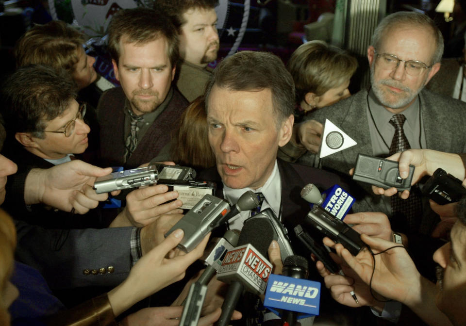 FILE - Then-Illinois Speaker of the House Michael Madigan, D-Chicago, center, speaks with the news media after meeting with other legislative leaders and the governor for budget talks at the Illinois State Capitol in Springfield, Ill., on Jan. 9, 2002. Madigan, the former speaker of the Illinois House and for decades one of the nation’s most powerful legislators, was charged with racketeering and bribery on Wednesday March 2, 2022, becoming the most prominent politician swept up in the latest federal investigation of entrenched government corruption in the state. (AP Photo/Seth Perlman, File)