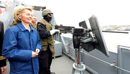 German Defense Minister Ursula von der Leyen stands beside a soldier of German special naval forces during her visit at the German army "Bundeswehr" in Kiel, Germany April 21, 2017. REUTERS/Fabian Bimmer