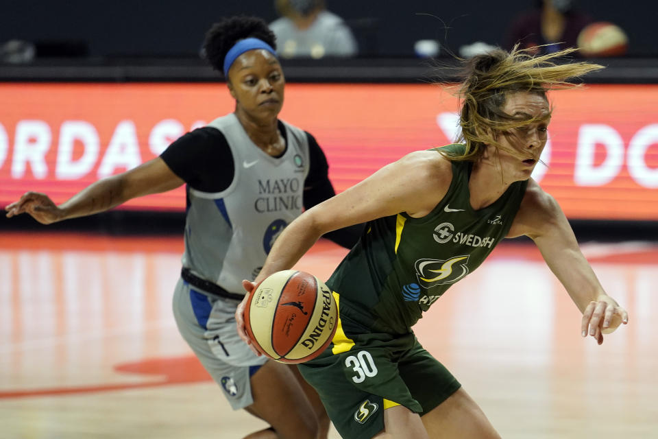 Seattle Storm forward Breanna Stewart (30) runs past Minnesota Lynx guard Odyssey Sims (1) during the second half of Game 2 of a WNBA basketball semifinal round playoff series Thursday, Sept. 24, 2020, in Bradenton, Fla. (AP Photo/Chris O'Meara)