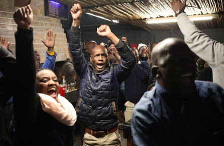 Patrons celebrate a goal by South Africa's Bongani Zungu, as they watch the Africa Cup of Nations 2019 (Afcon) quarter-final match between South Africa and Nigeria on TV at Toto's place, in Soweto