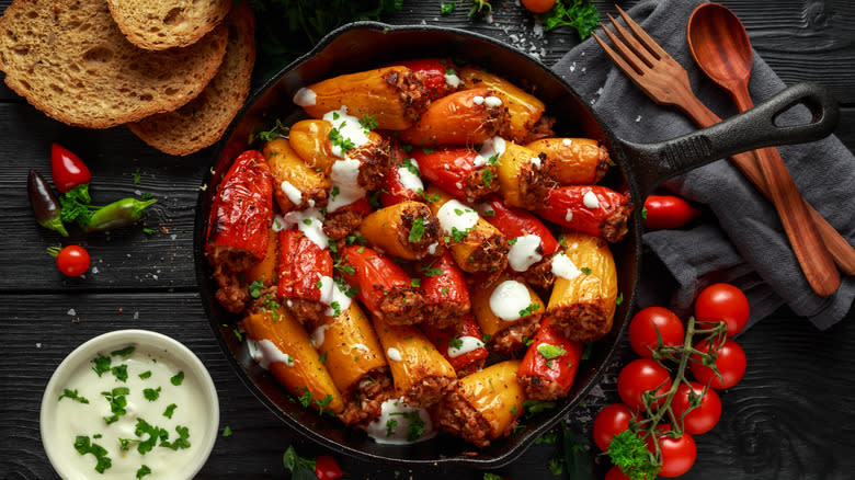 cast iron overfull of stuffed peppers