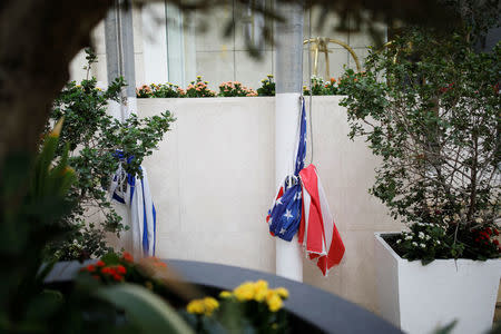 Israeli and U.S. national flags are tied around flag poles at the U.S. Embassy in Tel Aviv, Israel December 6, 2017. REUTERS/Amir Cohen