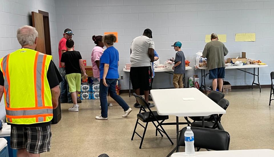 Residents affected by the storms that hit the Lookout Mountain area of Gadsden on Thursday take advantage Saturday of the services offered at the disaster resource center set up by the City of Gadsden at Mitchell Community Center.