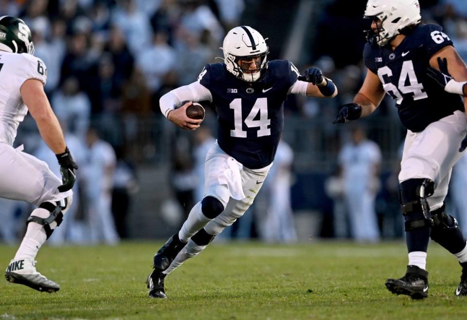 Penn State quarterback Sean Clifford cuts down the field with the ball during the game against Michigan State on Saturday, Nov. 26, 2022.