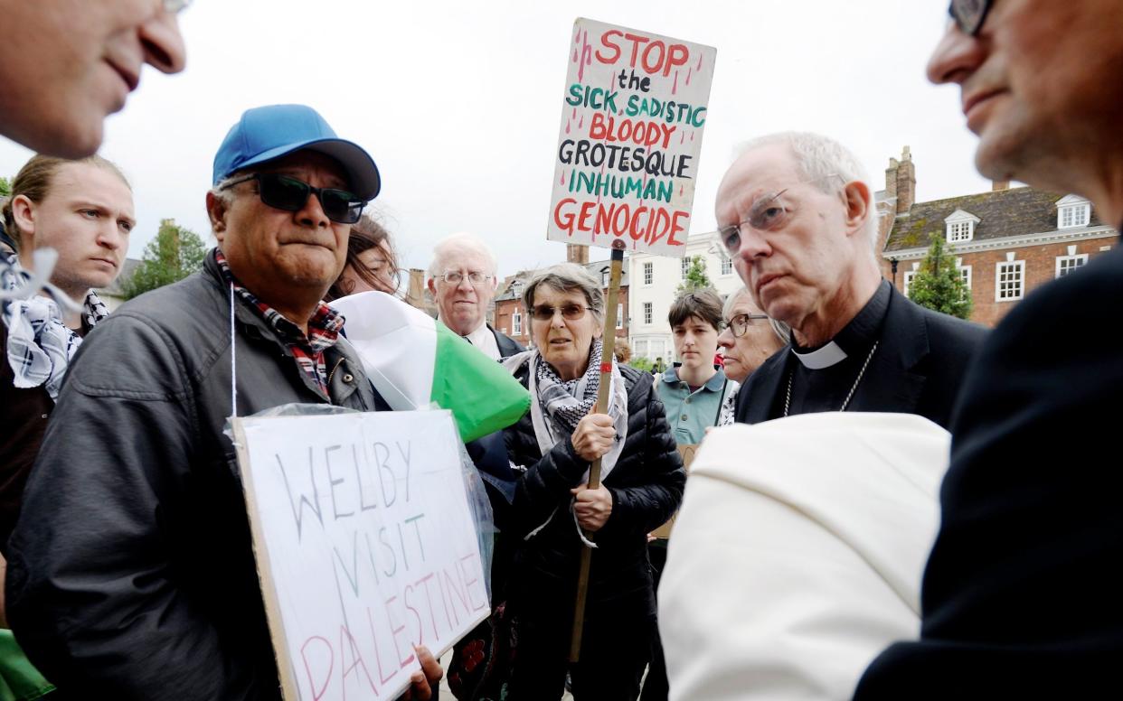 The Archbishop of Canterbury with pro-Palestinian protesters outside Gloucester Cathedral in May