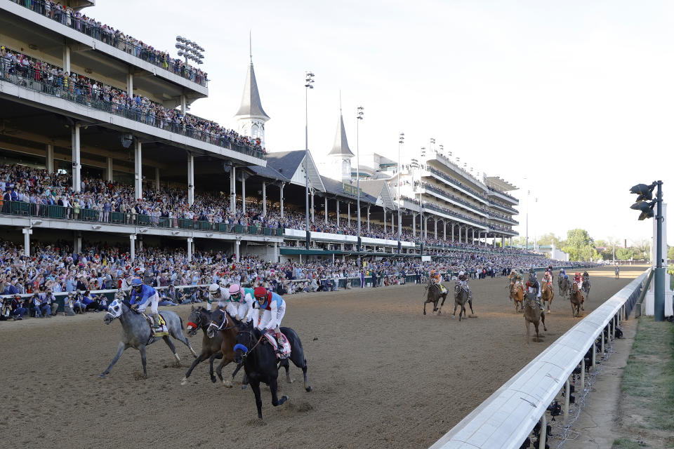 LOUISVILLE, KENTUCKY - MAY 01: Medina Spirit #8, ridden by jockey John Velazquez, crosses the finish line to win the 147th running of the Kentucky Derby ahead of Mandaloun #7, ridden by Florent Geroux, and Hot Rod Charlie #9 ridden by Flavien Prat , and Essential Quality #14, ridden by Luis Saez, at Churchill Downs on May 01, 2021 in Louisville, Kentucky. (Photo by Tim Nwachukwu/Getty Images)