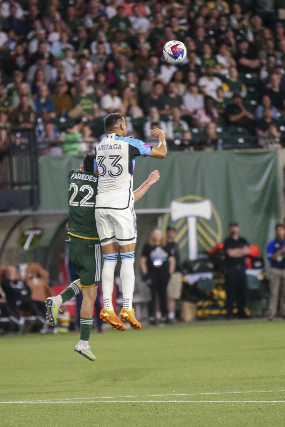 Portland Timbers midfielder Cristhian Paredes, left, goes up to head the ball against Minnesota United midfielder Kervin Arriagaduring an MLS soccer match at Providence Park in Portland, Ore. on Saturday, May 20, 2023. (Vickie Connor/The Oregonian via AP)