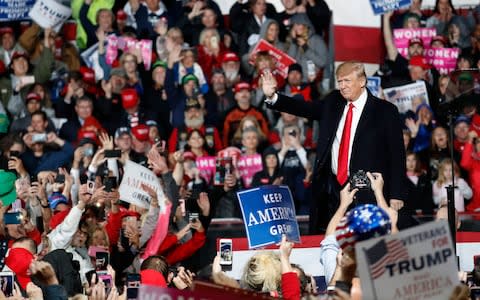 President Donald Trump waves to the crowd at a rally in Ohio, October 12  - Credit:  John Minchillo/AP