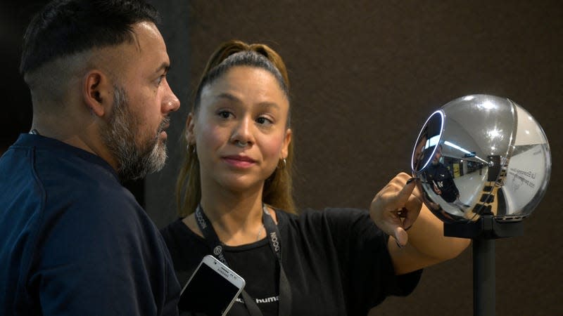 A man has his iris scanned with an orb, a biometric data scanning device, in exchange for the Worldcoin cryptocurrency in Buenos Aires on March 22, 2024. - Photo: Juan Mabromata / AFP (Getty Images)