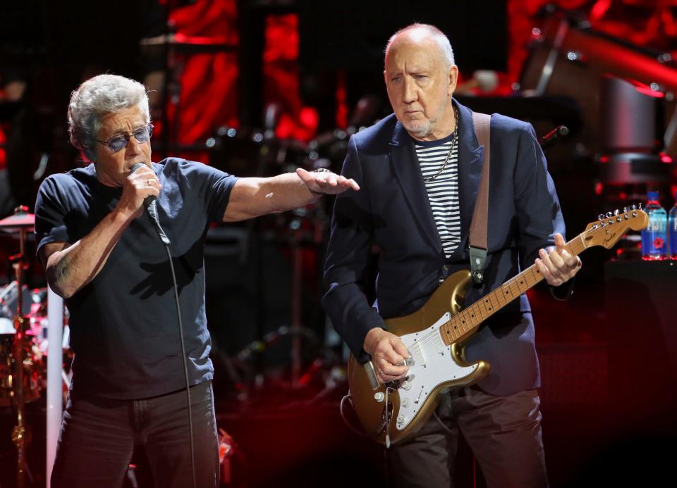 In this Wednesday, Sept. 18, 2019 photo, Roger Daltrey and Pete Townshend with The Who performs during the Moving On! Tour at State Farm Arena in Atlanta.