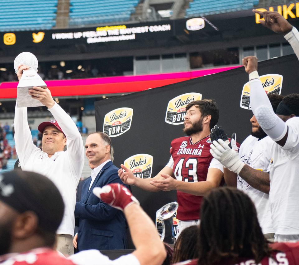 South Carolina head football coach Shane Beamer celebrates with his team after winning the Duke's Mayo Bowl last week in Charlotte.