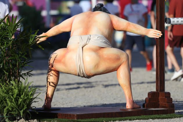 A rear view of the sumo wrestler during the equestrian jumping. (Photo: Julian Finney via Getty Images)