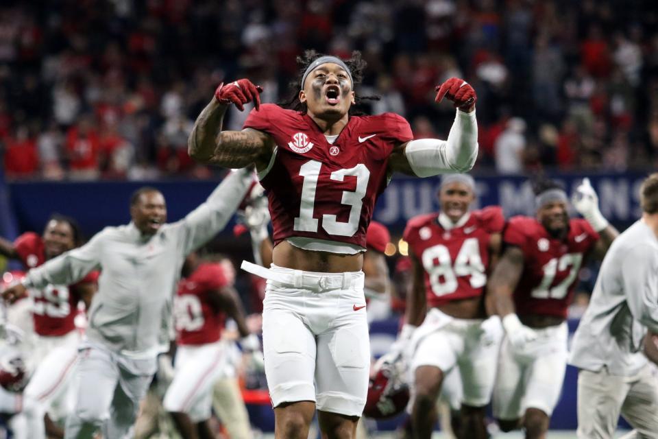 Alabama wide receiver Cole Adams (13) celebrates after the Crimson Tide defeated Georgia in the 2023 SEC championship game at Mercedes-Benz Stadium.
