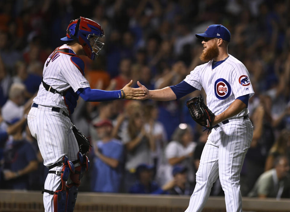 Chicago Cubs closing pitcher Craig Kimbrel right, celebrates with catcher Victor Caratini after the Cubs defeated the San Francisco Giants 12-11 in a baseball game Wednesday, Aug 21, 2019, in Chicago. (AP Photo/Paul Beaty)