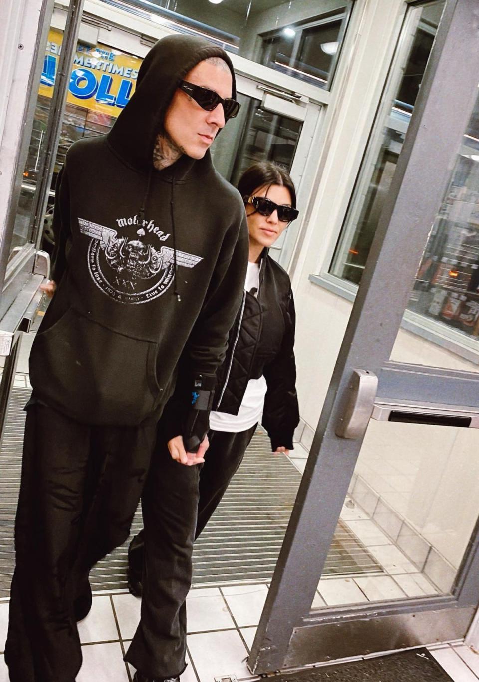 Kourtney and her husband Travis Barker at a petrol station (Kourtney Kardashian/Instagram)