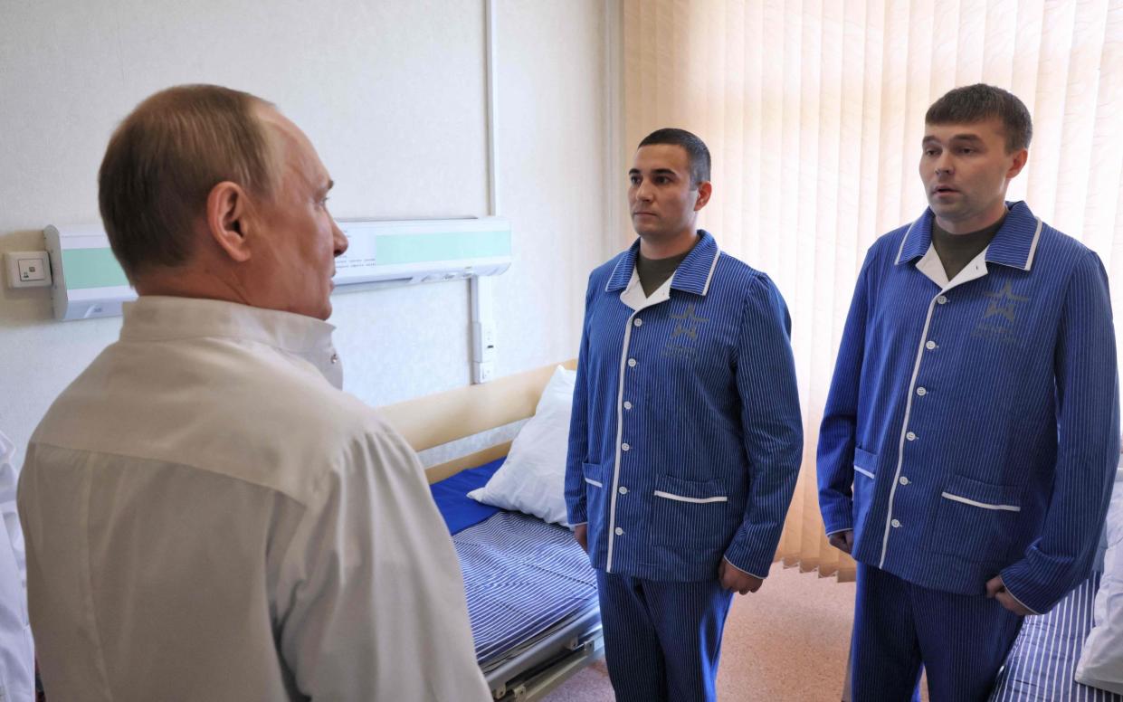 Vladimir Putin visited injured Russian servicemen at a military hospital in Moscow - Mikhail Metzel/Sputnik/AFP via Getty Images