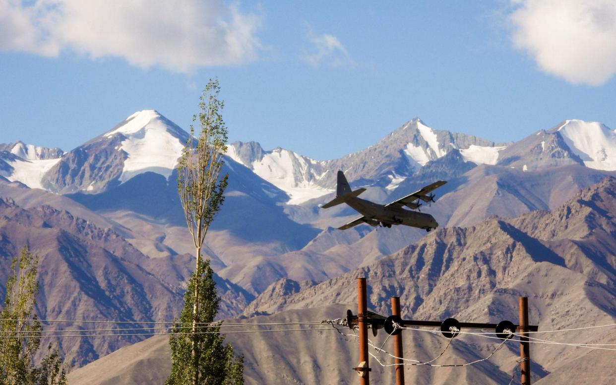 An Indian Air Force Hercules military transport plane prepares to land at an airbase in Leh