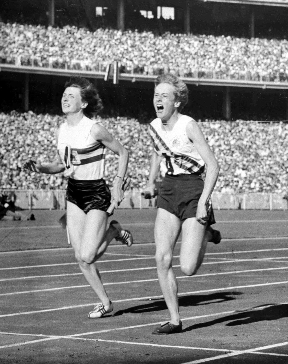 FILE - In this Dec. 1, 1956, file photo, Australia's Betty Cuthbert, right, wins the 4 x 100-meter relay final, in a new world Record time of 44.5 seconds, at Melbourne, Australia. (AP Photo/File)