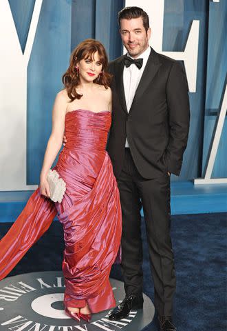 Jonathan Scott and Zoey Deschanel pose together.