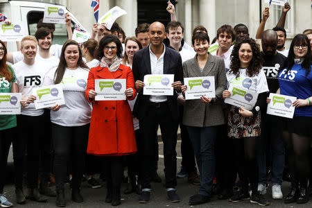 Labour Party MP Chuka Umunna, Liberal Democrat MP Layla Moran and Green MP Caroline Lucas stand with activists as they pose at the launch of the Peoples Vote advertising campaign in central London, Britain April 15, 2018. REUTERS/Simon Dawson