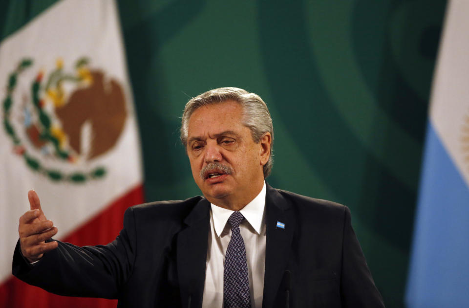 FILE - In this Feb. 23, 2021 file photo, Argentina's President Alberto Fernandez speaks during Mexican President Andrés Manuel Lopez Obrador's daily, morning news conference at the National Palace in Mexico City. Fernandez says he had an initial positive test for COVID-19, despite having been vaccinated in January. Fernandez sent a tweet late Friday, April 2, saying took a quick antigen test for the virus after feeling a headache and experiencing a fever of 37.3 Celsius (99.1 Fahrenheit). (AP Photo/Marco Ugarte, File)