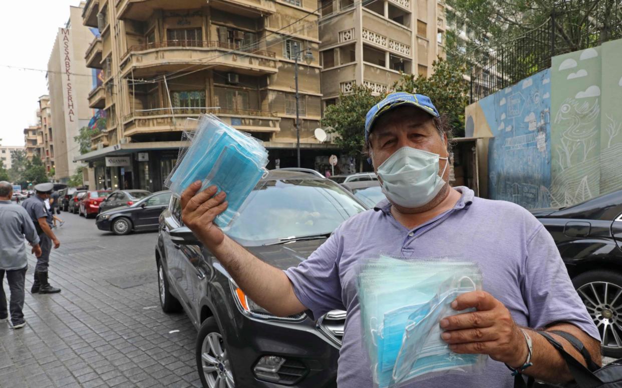 A man selling face masks in Beirut - Anwar Amro/AFP 