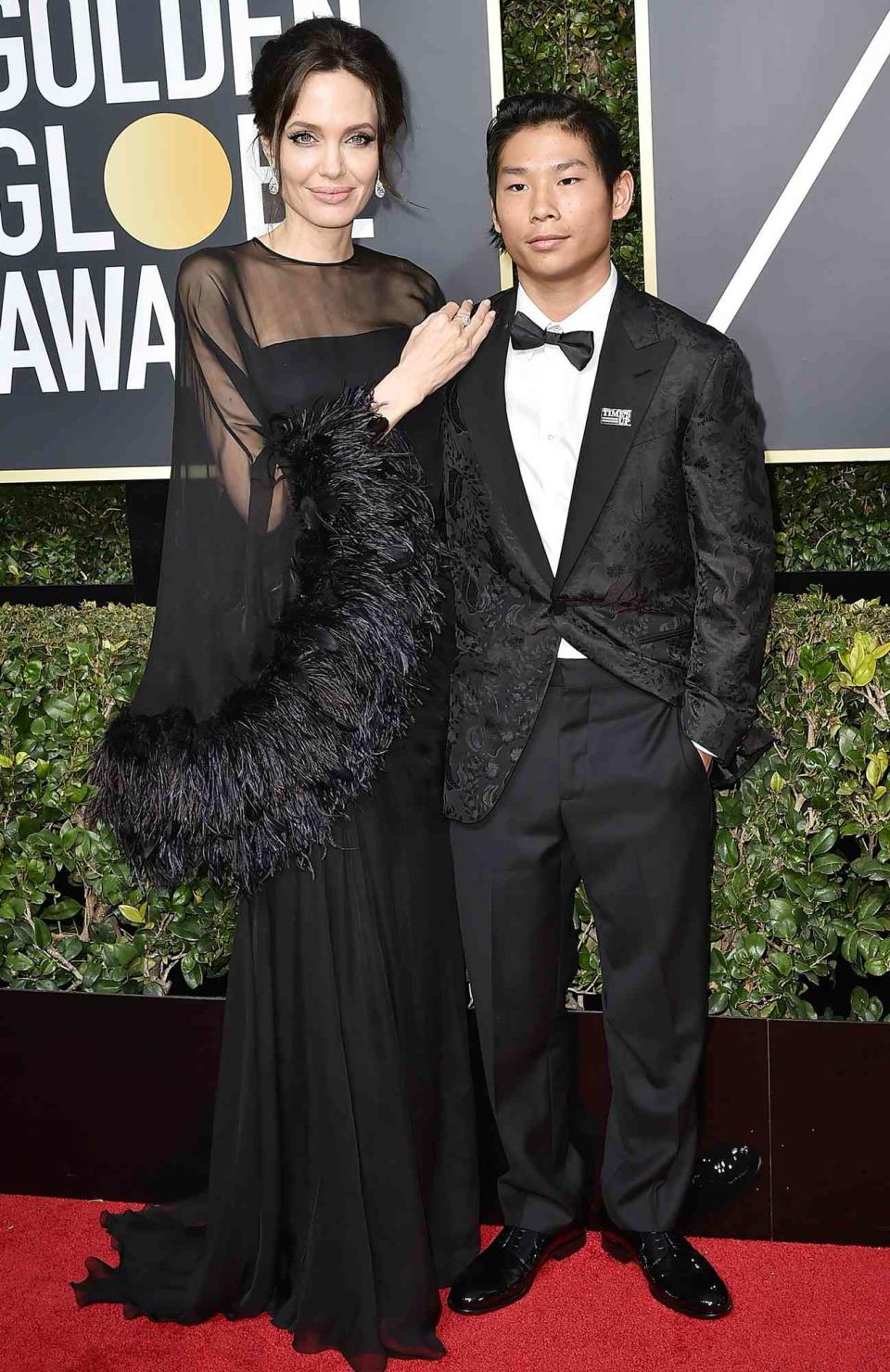 Angelina Jolie and Pax Jolie-Pitt attend the 75th Annual Golden Globe Awards - Arrivals at The Beverly Hilton Hotel on January 7, 2018 in Beverly Hills, California