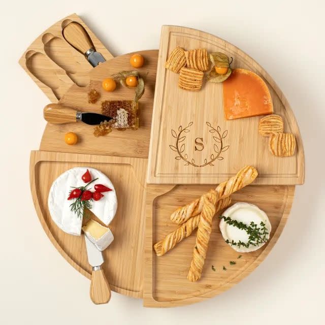 <p><a href="https://go.redirectingat.com?id=74968X1596630&url=https%3A%2F%2Fwww.uncommongoods.com%2Fproduct%2Fpersonalized-compact-swivel-cheese-board&sref=https%3A%2F%2Fwww.thepioneerwoman.com%2Fholidays-celebrations%2Fgifts%2Fg32145007%2Fhousewarming-gift-ideas%2F" rel="nofollow noopener" target="_blank" data-ylk="slk:Shop Now;elm:context_link;itc:0;sec:content-canvas" class="link rapid-noclick-resp">Shop Now</a></p><p>Personalized Swivel Cheese Board </p><p>uncommongoods.com</p><p>$63.00</p><span class="copyright">Uncommon Goods</span>