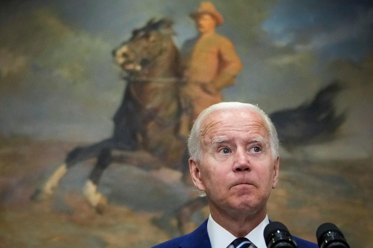 US President Joe Biden, his lips pursed as he looks to left, holds a press conference about Covid-19 vaccines for children in the Roosevelt Room of the White House June 21, 2022 in Washington, DC.