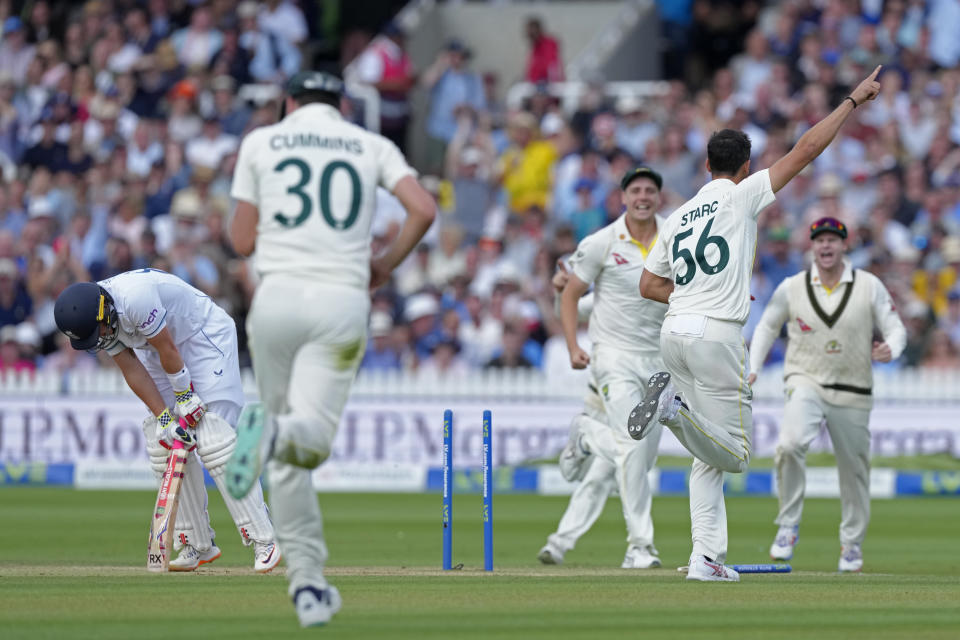 Australia's Mitchell Starc, second right, celebrates the dismissal of England's Ollie Pope, left, during the fourth day of the second Ashes Test match between England and Australia, at Lord's cricket ground in London, Saturday, July 1, 2023. (AP Photo/Kirsty Wigglesworth)