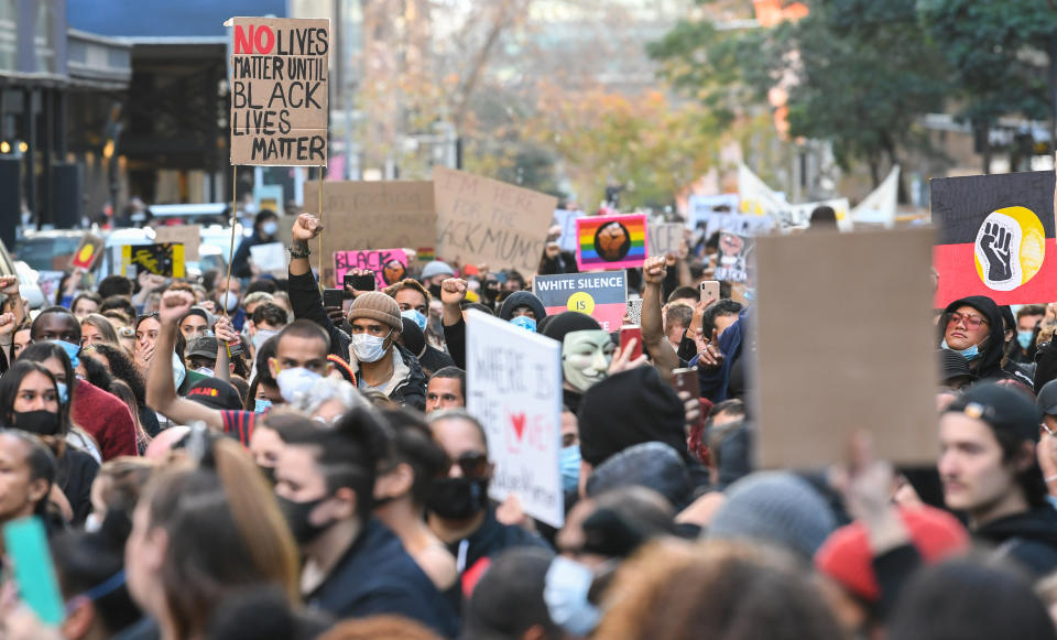 SYDNEY, AUSTRALIA - JUNE 06: Thousands of protestors marching in solidarity with "Black Lives Matter" down Castlereagh Street in the CBD on June 06, 2020 in Sydney, Australia. The event was organised to rally against aboriginal deaths in custody in Australia as well as in solidarity with protests across the United States following the killing of an unarmed black man George Floyd at the hands of a police officer in Minneapolis, Minnesota. (Photo by James D. Morgan/Getty Images)