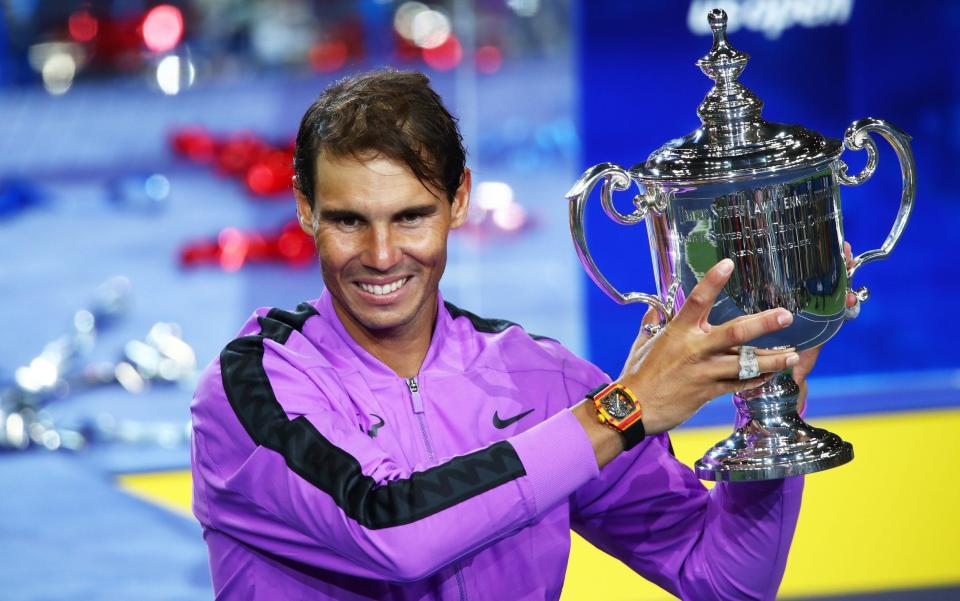 Rafael Nadal poses with the US Open trophy on Sunday night - Getty Images North America