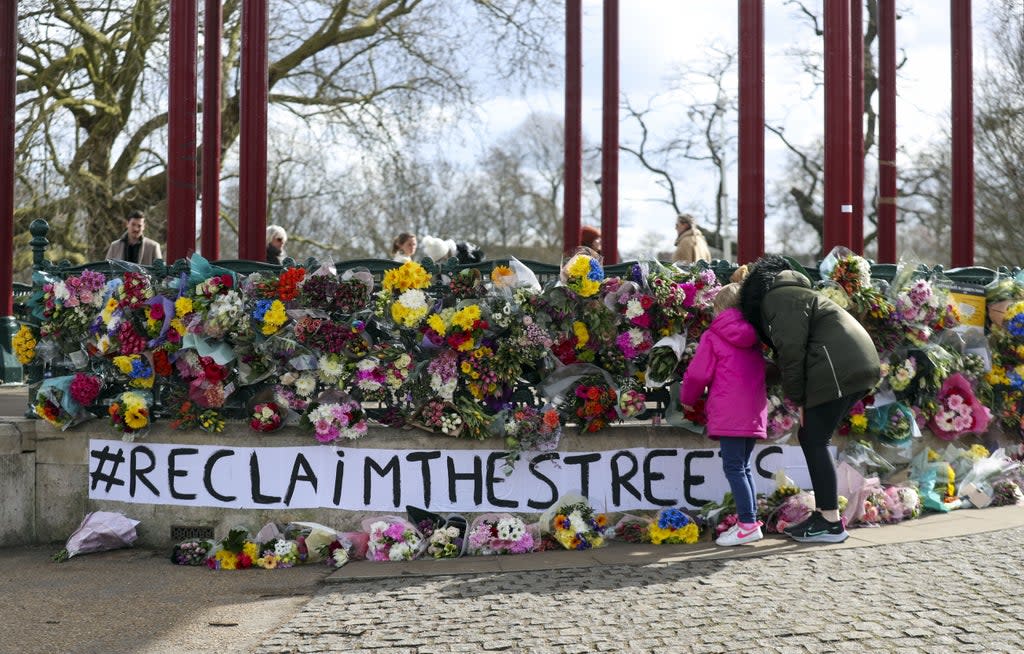 People leave floral tributes at the band stand in Clapham Common (Steve Parsons/PA) (PA Archive)