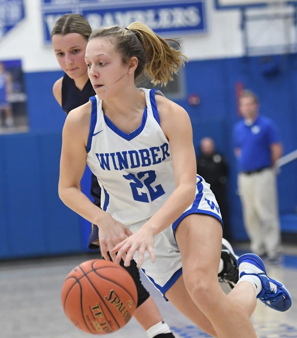 Windber's Harmony Jablon (22) gets to the basket around Shade's Kendahl Stutzman during a girls WestPAC basketball contest, Jan. 11, in Windber.