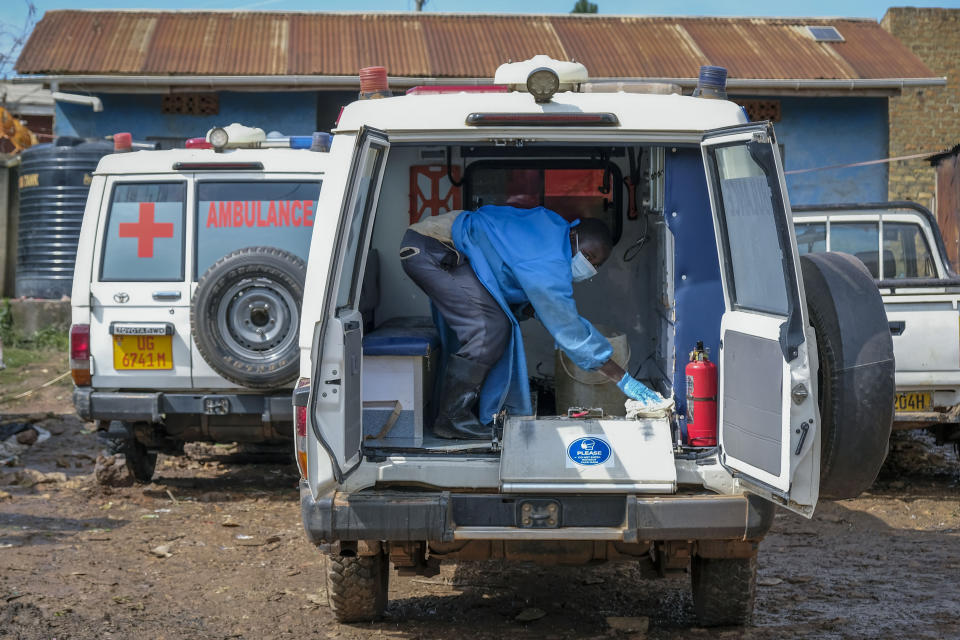 A man wearing protective clothing washes the interior of an ambulance used to transport suspected Ebola victims, in the town of Kassanda in Uganda, Tuesday, Nov. 1, 2022. Ugandan health officials say they have controlled the spread of a strain of Ebola that has no proven vaccine, but there are pockets of resistance to health measures among some in rural communities where illiteracy is high and restrictions on movement and business activity have left many bitter. (AP Photo/Hajarah Nalwadda)