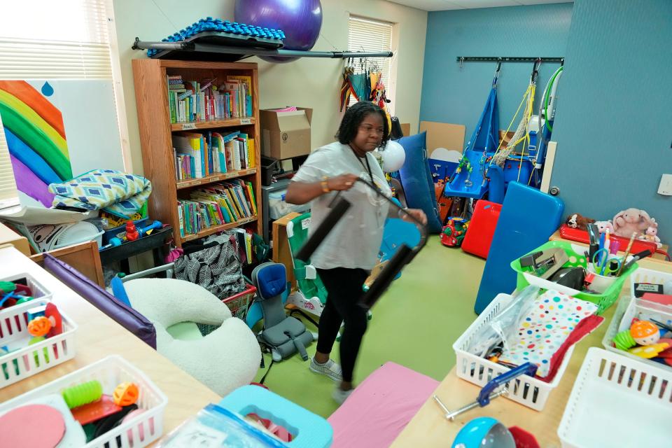 Dora Agyeman Ampaw, an early childhood education and special education student at the University of Wisconsin Whitewater, works in the early education classroom at Vision Forward on North Hawley Road in Milwaukee on Tuesday, Aug. 8, 2023.  The nonprofit rehabilitation center for blind and visually impaired people includes a preschool to teach young kids how to navigate the world; physicians, physical therapists, and occupational therapists on site.