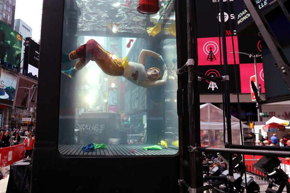 A performer takes part in climate change event in Times Square, New York City