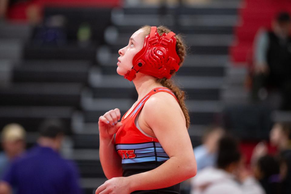 Shawnee Heights' Odessa Schmidt says a prayer before her bout at the United Kansas Conference Championship Saturday, February 3, 2024, inside Shawnee Heights High School.