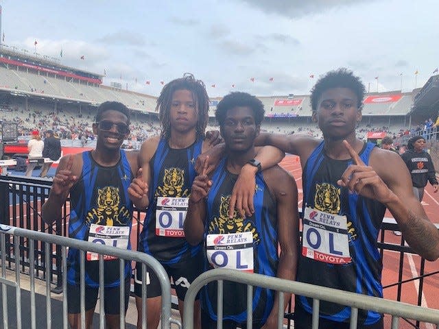 Jalen Wright, Dallas Parker, Lathan Love-Brown and Donte Dockery of A.I. du Pont High celebrate their 4 x 400 Northern Delaware relay win at the Penn Relays.