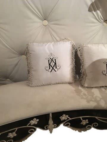 Custom pillows feature Kim's favorite letter. (Photo: Premiere Props)