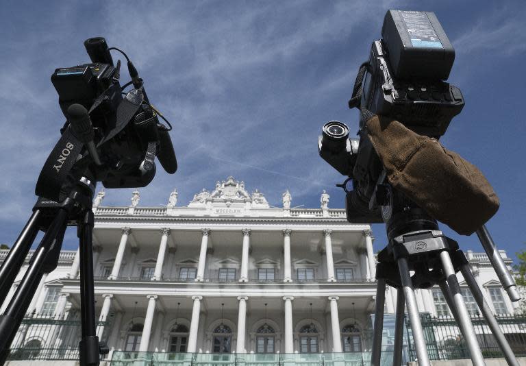 TV crews wait outside Coburg Palace the venue of talks between Iran and world powers in Vienna, on April 22, 2015