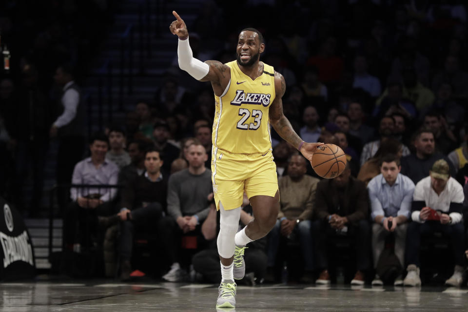 Los Angeles Lakers' LeBron James (23) calls out to his teammates during the first half of an NBA basketball game against the Brooklyn Nets Thursday, Jan. 23, 2020, in New York. (AP Photo/Frank Franklin II)