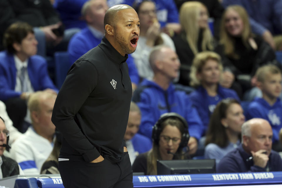 UNC Wilmington head coach Takayo Siddle yells to his team during the first half of an NCAA college basketball game against Kentucky in Lexington, Ky., Saturday, Dec. 2, 2023. (AP Photo/James Crisp)