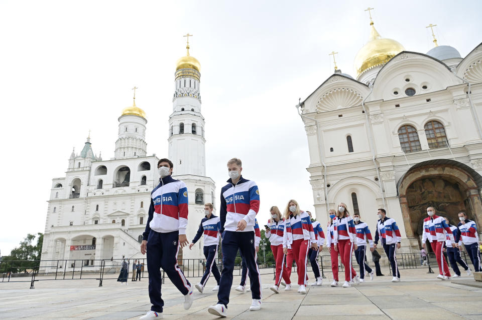 Russian athletes prepare to greet President Putin before heading to the Tokyo Olympics. (Sergei Guneyev\TASS via Getty Images)