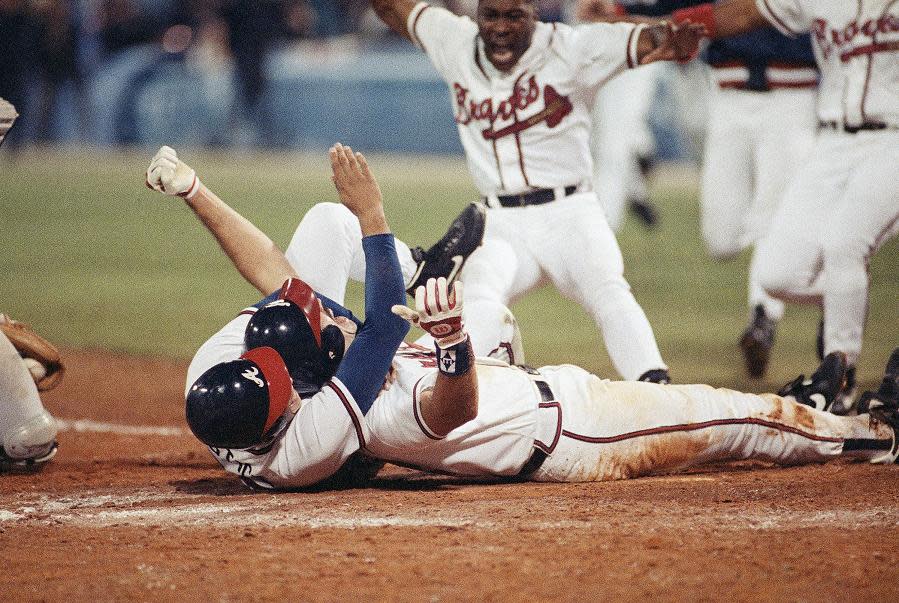 Sid Breams scores the winning run for the Braves in Game 7 of the 1992 NLCS. (AP)