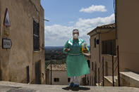 Nurse Pilar Rodríguez arrives at the small town of Buger, barely a thousand inhabitants, at the Spanish Balearic Island of Mallorca, Spain, Friday, April 23, 2021. Pilar Rodríguez, age 49, is one of three nurses in the town of Sa Pobla in the interior of the island to administer shots against COVID-19 there and in nearby villages as Buger.(AP Photo/Francisco Ubilla)