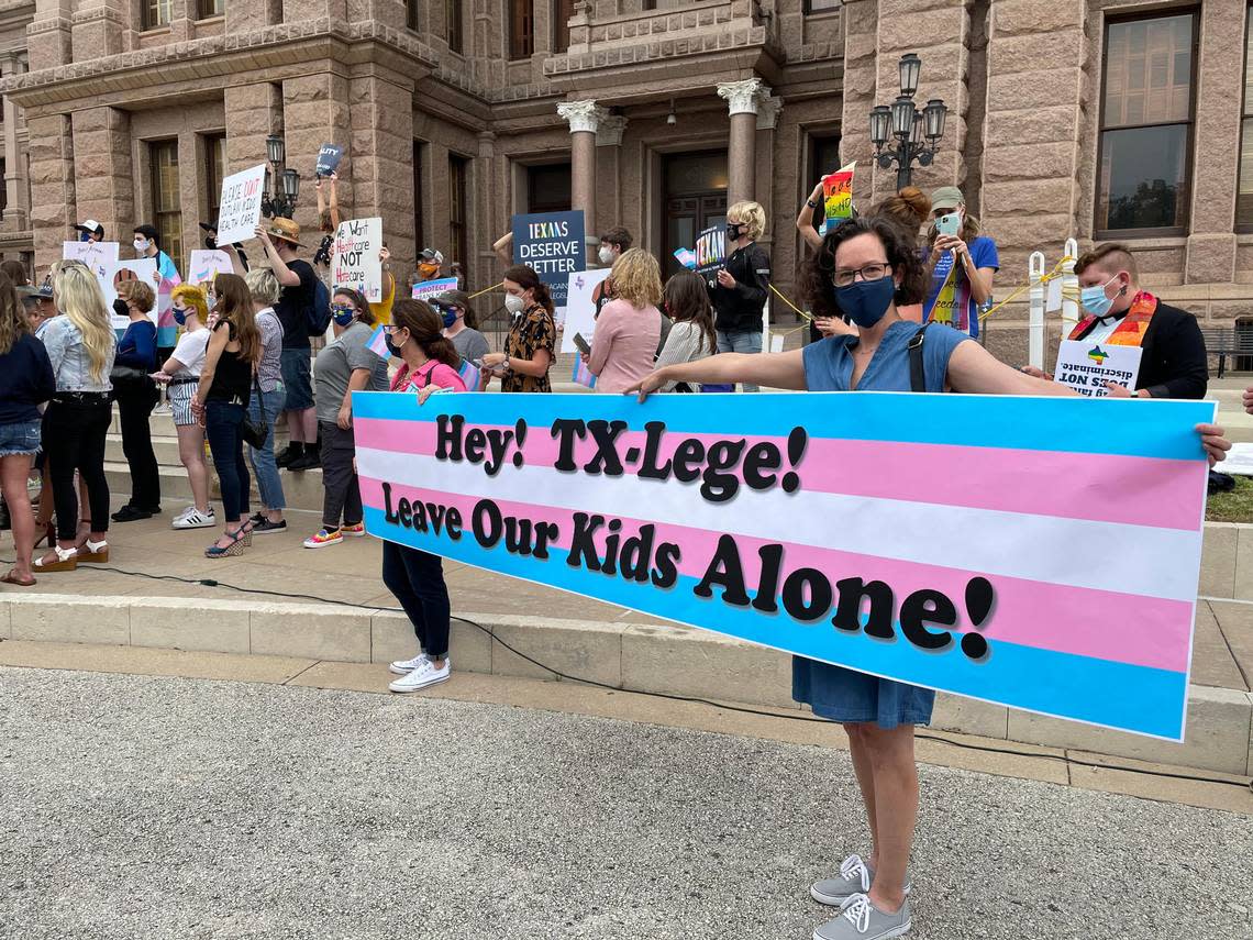 LGBTQ advocates protest legislation that impacts transgender kids at the Texas Capitol on April 28, 2021.