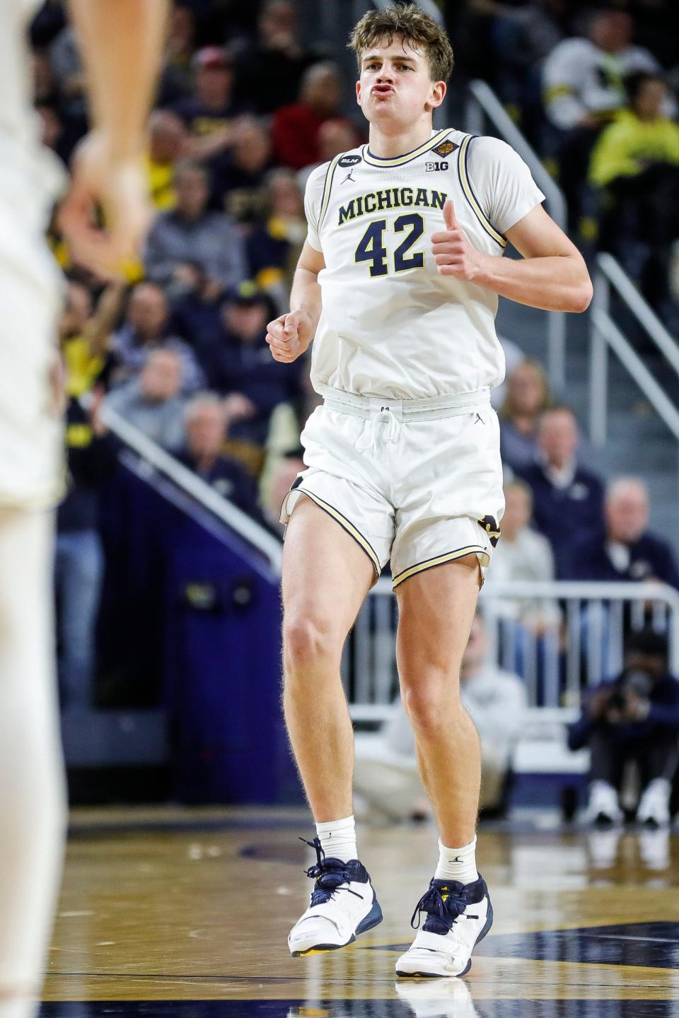 Michigan forward Will Tschetter (42) reacts after scoring against Toledo during the second half of the first round of the NIT at Crisler Center in Ann Arbor on Tuesday, March 14, 2023.